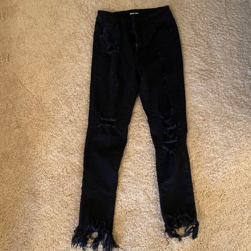Black ripped jeans with frayed ankle detail